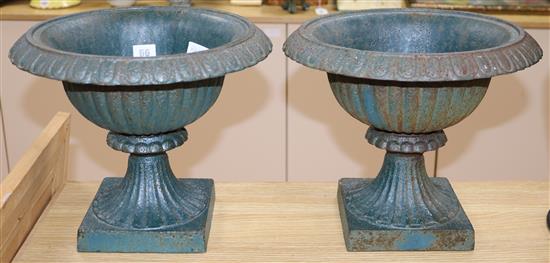 A pair of metal garden urns height 29cm diameter 32cm